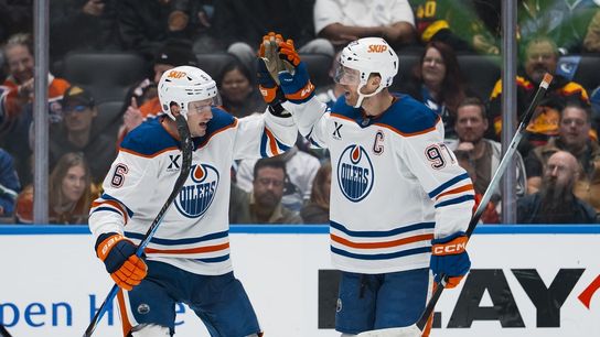 Evan Bouchard, Connor McDavid make waves as Oilers beat Canucks 9-7 (NHL)