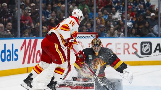 Canucks keep Flames winless with 4-goal third period (NHL). Photo by Bob Frid